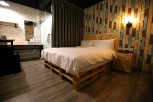 Postel nebo postele na pokoji v ubytování NYS Loft Hotel