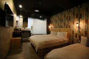 Postel nebo postele na pokoji v ubytování NYS Loft Hotel