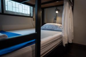 Dreamcatcher Bangkok客房内的一张或多张床位