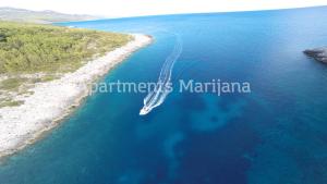an aerial view of a boat in a body of water at Apartments Marijana in Zavalatica