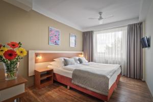 Cama o camas de una habitación en Hotel Aida