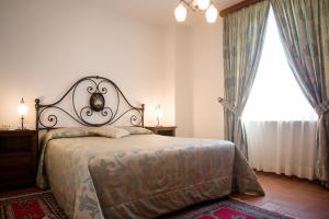 Posteľ alebo postele v izbe v ubytovaní Dimora Palazzo La Fenice