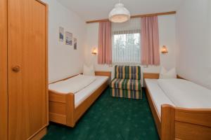 Postel nebo postele na pokoji v ubytování Pension Garni Appartement Ortner