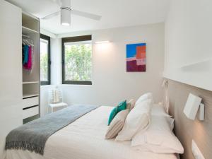 A bed or beds in a room at Beachfront Apartment Siesta 21 San Agustin Playa by VillaGranCanaria
