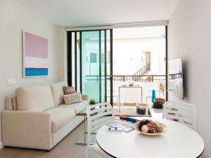 A seating area at Beachfront Apartment Siesta 21 San Agustin Playa by VillaGranCanaria
