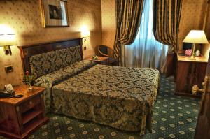 Postel nebo postele na pokoji v ubytování Hotel Cilicia