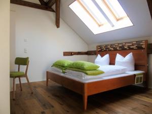 a bedroom with a bed with a skylight at Brauhaus 3 - Adults only in Königsberg in Bayern