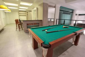 a pool table with balls on it in a room at Life Hotel Torres in Torres