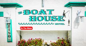 a sign on the side of a boat house at The BoatHouse in Marco Island