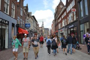 a group of people walking down a city street at B&B MACBED CHECKIN-TIME 1700-1800 or request before you book in Alkmaar