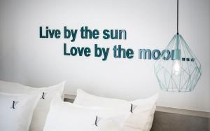 live by the sun love by the most vinyl wall art sticker at Venus Resort in Tsilivi