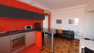 a kitchen with a black counter top in a room at Italianway-Lodi 78 in Milan