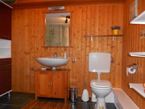 a bathroom with a white toilet and a sink at Haus am Stadtrand in Ettenheim