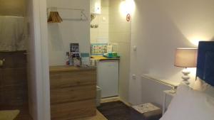 Kuchyň nebo kuchyňský kout v ubytování Jure Apartment