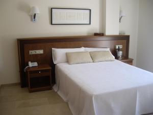 Postel nebo postele na pokoji v ubytování Hotel San Sebastián Hospedería