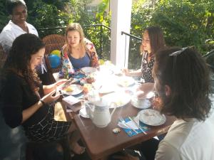 a group of women sitting around a table at Nimsara Homestay in Ella