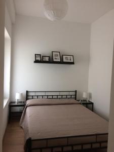 A bed or beds in a room at La Porta Nel Giardino