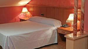 Postel nebo postele na pokoji v ubytování Hotel Real de Castilla