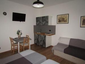 a bedroom with a bed and a table and a bed and a desk at Il Batacchio B&B in Minerbio