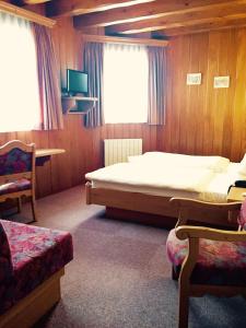 TV a/nebo společenská místnost v ubytování Hotel et Spa du Scharrach