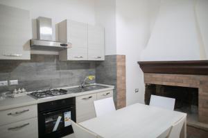 Kuchyňa alebo kuchynka v ubytovaní La Sosta B&B + 14 fotografií