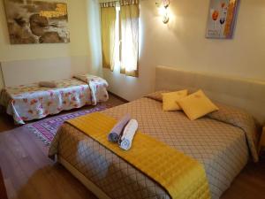 Voodi või voodid majutusasutuse Cadorna Chalet toas