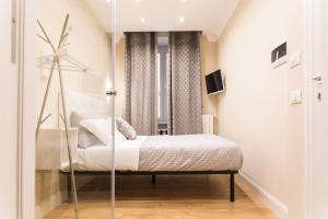 A bed or beds in a room at Nazionale Palace Suites