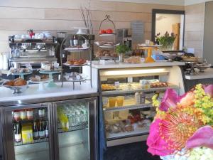 a kitchen with an open refrigerator with food in it at Inn on Bellevue in Newport