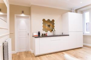 A kitchen or kitchenette at Nazionale Palace Suites