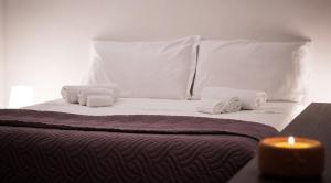 Кровать или кровати в номере Masseria D'Aprile