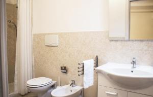 a bathroom with a toilet and a sink at Masseria D'Aprile in Castellaneta +8 photos