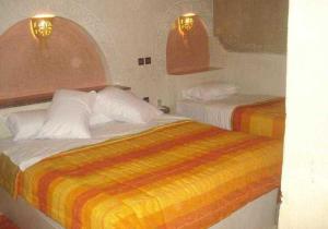 Postel nebo postele na pokoji v ubytování Palmeras Y Dunas Luxery Camp