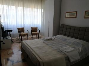 Postel nebo postele na pokoji v ubytování B&B Domus Lupiae