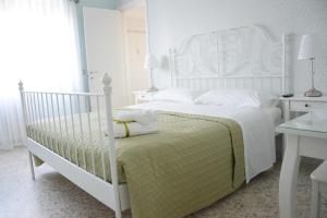 Posteľ alebo postele v izbe v ubytovaní San Lorenzo