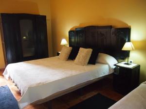 Uma cama ou camas num quarto em Casa das Magnólias de Igarei