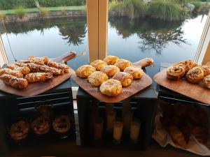 a bunch of different types of bread and pastries at Grand Arden Monaco Nelson in Nelson
