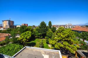 an aerial view of a city with trees and buildings at Pemaj Hostel in Shkodër