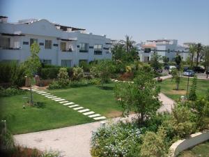 a garden in front of a building at Sunterra Resort in Sharm El Sheikh