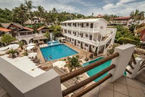 an aerial view of a house with a swimming pool at Bungalows Zicatela in Puerto Escondido