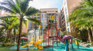 a playground in a resort with a water slide at Atlantis Condo Resort Jomtien TLH in Jomtien Beach