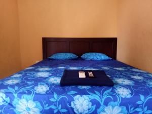Tempat tidur dalam kamar di Homestay 77 Borobudur