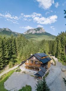 an aerial view of a large house in the mountains at Rekreačný dom - Chata pod Lampášom in Terchová