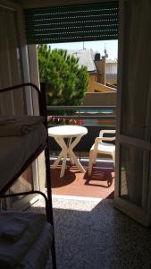 a view of a patio with a table and chairs at Fiorina Bed&Breakfast - Colazione fino a mezzogiorno - Beach Village gratuito in Riccione