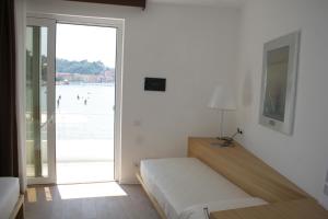 Voodi või voodid majutusasutuse Piccolo Hotel Del Lido toas