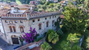 an aerial view of an old house in a city at Casa Castello in Salò