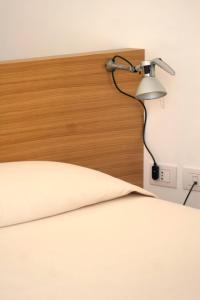 Voodi või voodid majutusasutuse Piccolo Hotel Del Lido toas