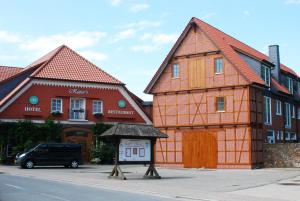 a couple of buildings on the side of a street at Rüter's Hotel & Restaurant in Salzhausen