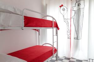 A bed or beds in a room at Shalai Relais Apartment