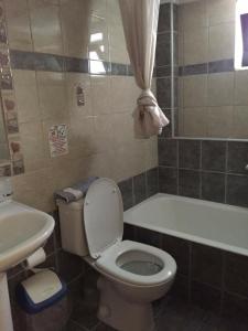 Koupelna v ubytování Eva Rooms