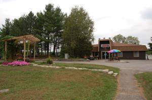 a building with a pavilion and a picnic shelter at St. Clair Camping Resort in Marysville